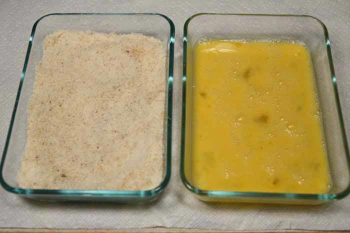 Set up two shallow bowls: beaten eggs in one, and the parmesan, garlic powder, and pepper mixed in the other.