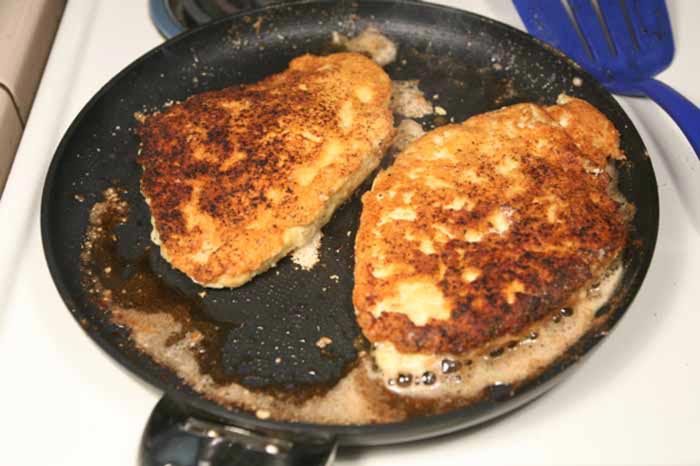 In a non-stick skillet, flash-fry the chicken in melted butter until golden brown.