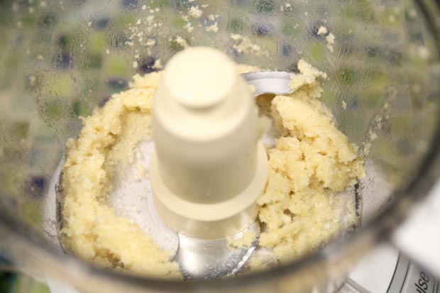 Puree the garlic until finely chopped, scrape down the sides, and puree again.
